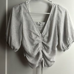 Chiffon white black polka dot v neck. Back elastic band front Zinch drawstring